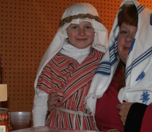 Mother and son, the Knowltons play a bean merchant and her son at a living nativity play performance. Photo by Chris Brunson.