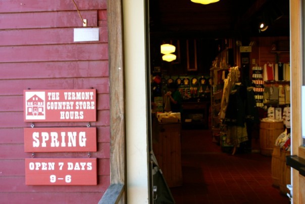 Spring hours at the entrance to the cheese shop.