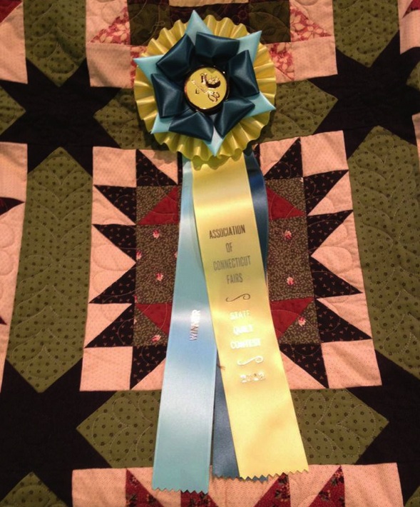 Winner of the state quilt competition and the ribbon awarded at the